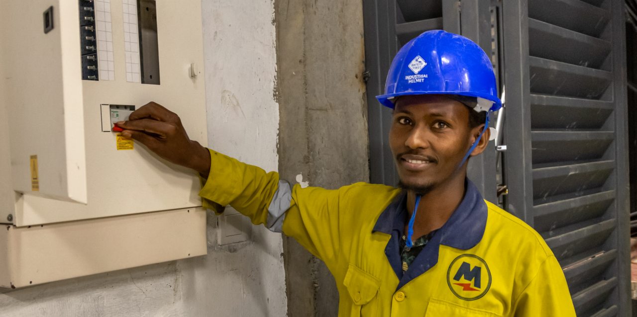 Apprentice Diba Godana Boru, 25, at a new building on General Mathenge drive in downtown Nairobi, whose electricals are contracted to Mehta Electrical, the largest electrical contractor in the region, May 14, 2024.

Diba is an orphan who grew up in a children's home. He was awarded a scholarship to go to a high school, but had to drop out of university opportunity due to lack of school fees. 

PropelA program is a lighthouse project implemented by Swisscontact, funded by Hilti Foundation, and trained at Don Bosco Boys' Town in Nairobi. The first cohort of PropelA apprentices were 100 and were admitted in 2022 (78 male and 22 female apprentices). The application is open to young men and women who are passionate about plumbing and electrical trades. They must have completed secondary school and are aged 18-30.

The program is aimed at economic empowerment, providing rural population and the younger generation in the cities of East African countries with the opportunity to earn their living by giving them training of the skills they need to improve their economic prospects and sustain their livelihoods, to escape poverty and become part of an emerging middle class. 


Photography Georgina Goodwin www.georginagoodwin.com for Hilti Foundation

