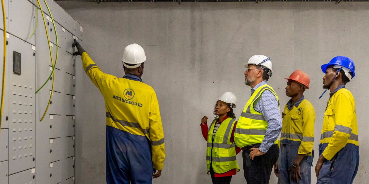 Electrical apprentices in the field at a building site in Nairobi contracted to Mehta Electricals, talk with Hilti Foundation CEO Werner Wallner and Chairman Matthias Gillner, and Swisscontact Country Director Lillian Mwai, during Hilti Foundation visit to PropelA dual apprenticeship program in Nairobi, Kenya, funded by Hilti Foundation, implemented by Swisscontact,  May 14, 2024. 

PropelA program is a lighthouse project is about economic empowerment, aimed at providing rural population and the younger generation in the cities of East African countries with the opportunity to earn their living by giving them training of the skills they need to improve their economic prospects and sustain their livelihoods, to escape poverty and become part of an emerging middle class. 

PropelA dual apprentice program is funded by Hilti Foundation and implemented by partner Swisscontact. It has been successfully implemented with strong commitment from both the government and the private sector where 40 leading Kenyan plumbing and electrical companies have agreed to employ a first cohort of 250 trainees, who will graduate with a national diploma after two years of training through Don Bosco, Kenya. 

Photography Georgina Goodwin www.georginagoodwin.com