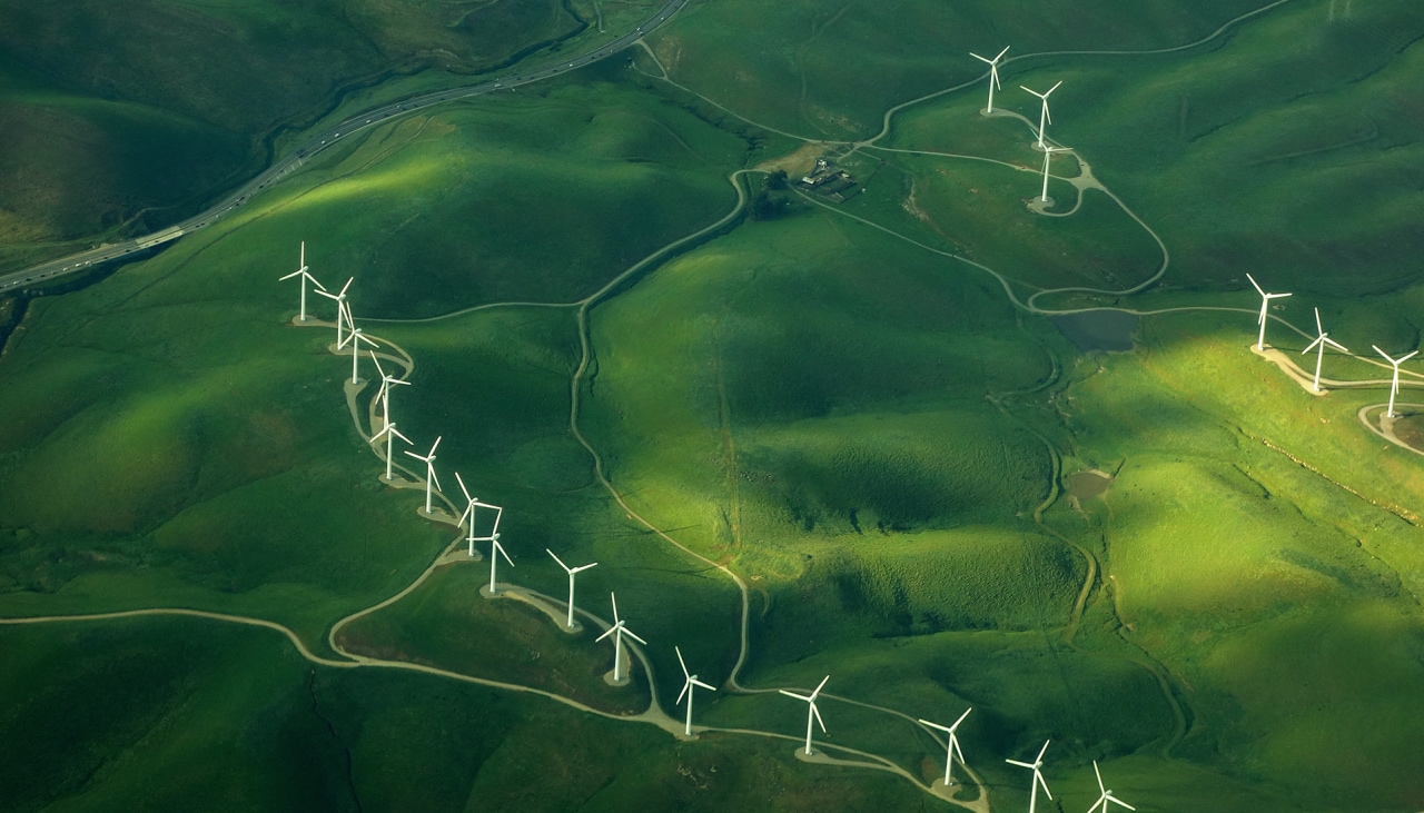 1018298440 beautiful green aerial view of windmill farm providing eco-friendly energy sustainabilityÂ